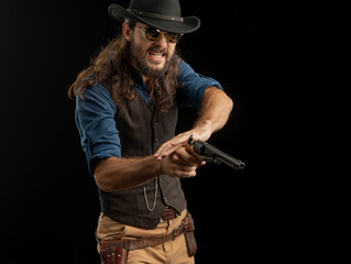 Cowboy with guns. Studio shooting