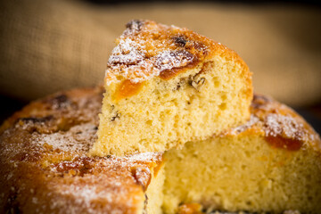 cooked sweet biscuit with dried apricots and nuts inside