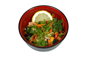 vegetables and seafood salad on a plate it is isolated on a white background