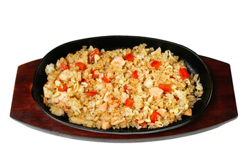 the dish rice with chicken and ovoshchvm in a frying pan is isolated on a white background
