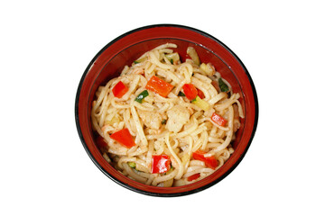 noodles with chicken and vegetables in a soup plate it is isolated on a white background