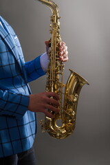 Obraz premium young saxophone player