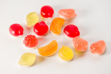 Colorful collection of tasty gelatin candies on white background. View from above.