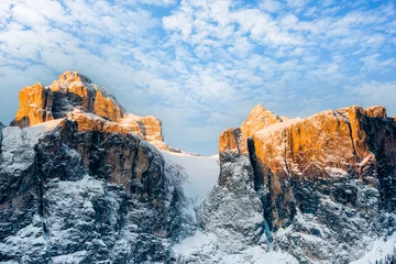 Papier Peint photo autocollant Dolomites Dolomite Mountains covered with clouds in winter, view for the Brunecker Turm. Sunrise.