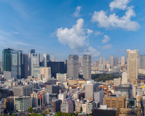 Fototapeta premium Landscape of tokyo city skyline in Aerial view with skyscraper, modern office building and blue sky background in Tokyo metropolis, Japan.