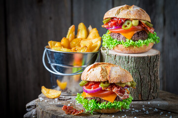 Sandwich made of beef, cheese and vegetables. American cuisine.