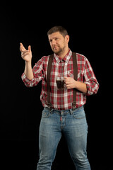 Young stylish man. Studio photo on a black background.