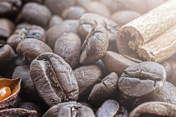 macro texture of roasted coffee bean with cinnamon in sunlight, close-up, selective focus
