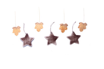 Obraz premium autumn leaves and wooden stars isolated on white background flat lay