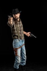 Cowboy with guns. Studio shooting