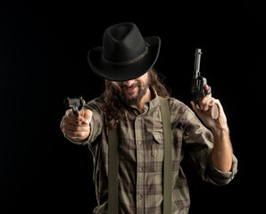 Fototapeta na wymiar Cowboy with guns. Studio shooting