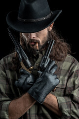 Cowboy with guns. Studio shooting