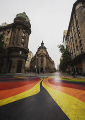 Urban cityscape of historical old building at colorful painted street art bandera in Santiago de...