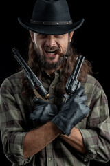 Cowboy with guns. Studio shooting