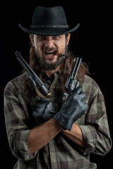 Cowboy with guns. Studio shooting