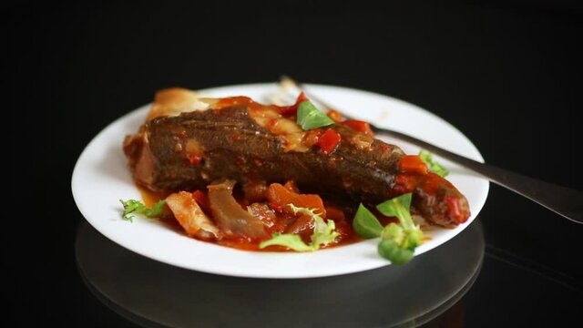 whole fish hake stewed with carrots, beets, peppers and other