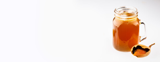 Tamarindus indica - Tamarind juice in a glass, sweet organic ripe tamarind