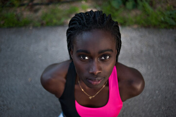 high angle view of a beautiful black woman on the floor after  exercising.