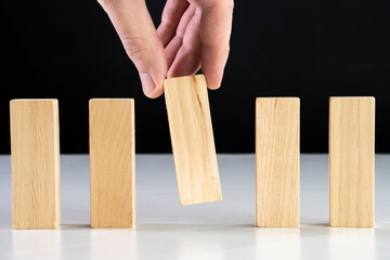 Business relationship concept arranging small wooden block on white background.