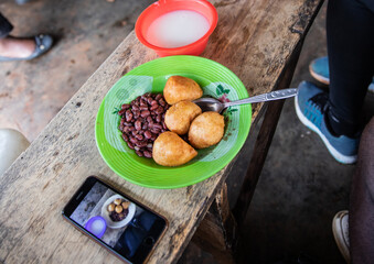 Traditional cameroonian food, beignets haricots,  photographed to be posted  on  social medias. 