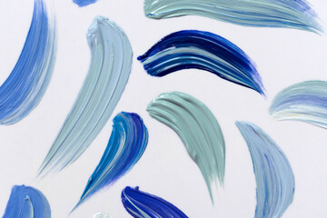 Obraz premium Blue tones paint strokes on white.Abstract background.