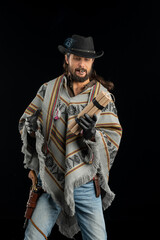 Cowboy with guns. Studio shooting