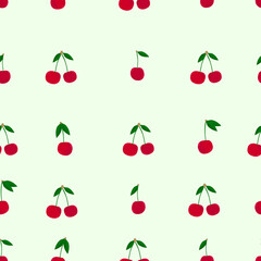 Seamless pattern with red, ripe cherries with green leaves on a light green background