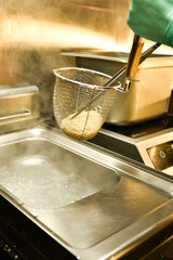 noodles are cooked in boiling water on the stove