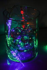 glass balls with a garland in a vase