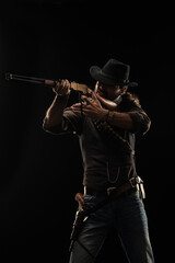 Cowboy with guns. Studio shooting