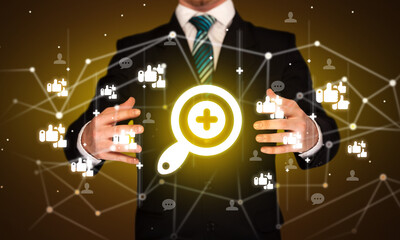 Hand holding social media icons