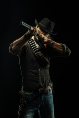 Fototapeta na wymiar Cowboy with guns. Studio shooting