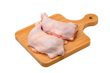 Raw chicken leg on cutting board isolated on white background with Clipping Path