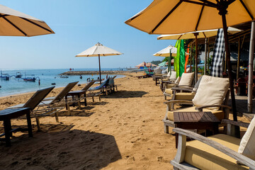 Empty chairs on sanur beach, Bali. Beach chairs. No Tourism.