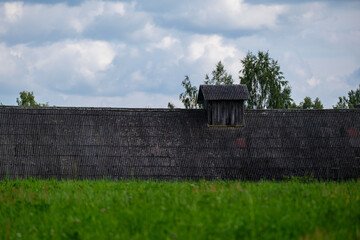 countryside house garden backyard in summer with old buildings and decorations