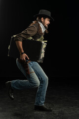 Cowboy with guns. Studio shooting