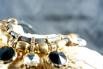 Costume jewelry made of fake gold and silver and artificial gemstones photographed in the studio