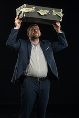Young stylish man. Studio photo on a black background.