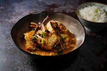 Homemade Singapore chilli crab served with jasmine rice, selective focus