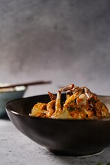 Homemade Singapore chilli crab served with jasmine rice, selective focus