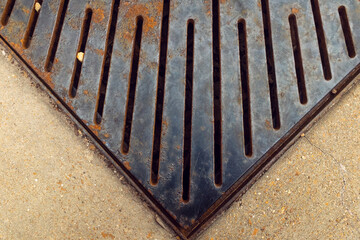 Rusted metal grate with radiating lines