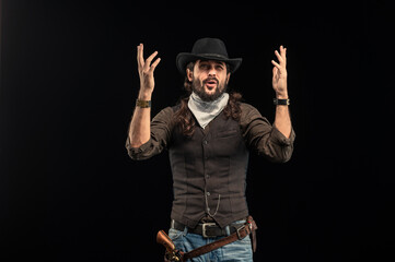 Cowboy with guns. Studio shooting