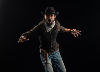 Cowboy with guns. Studio shooting