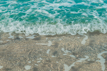 Soft wave of blue sea and sand on summer holidays beautiful beach, Background, Travel concept, Selective focus.