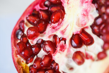 Close up pomegranate fruit cut with seeds