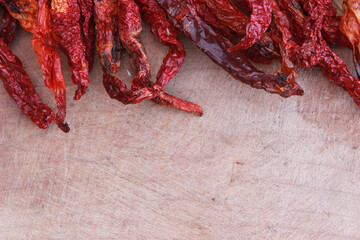 red peppers on the wooden table for food background. Copy space for your text. 