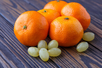 Mandarine orange or tangerine on wooden board