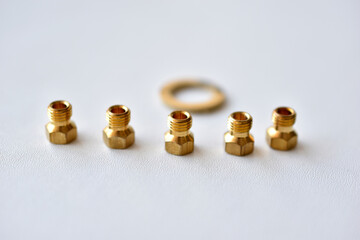 Golden gas burner nozzle bolt on white background