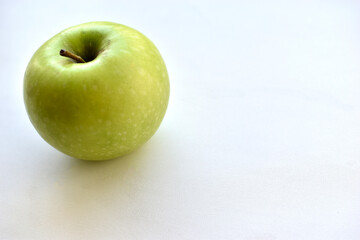 Green apple on white background with shadow