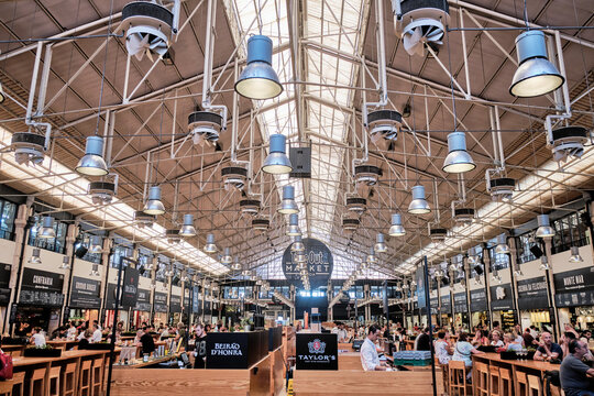 LISBON, PORTUGAL - AUGUST 26, 2019: Time Out Market is a food hall located in Mercado da Ribeira at Cais do Sodre in Lisbon and is a major touristic attraction for food lovers all over the world.